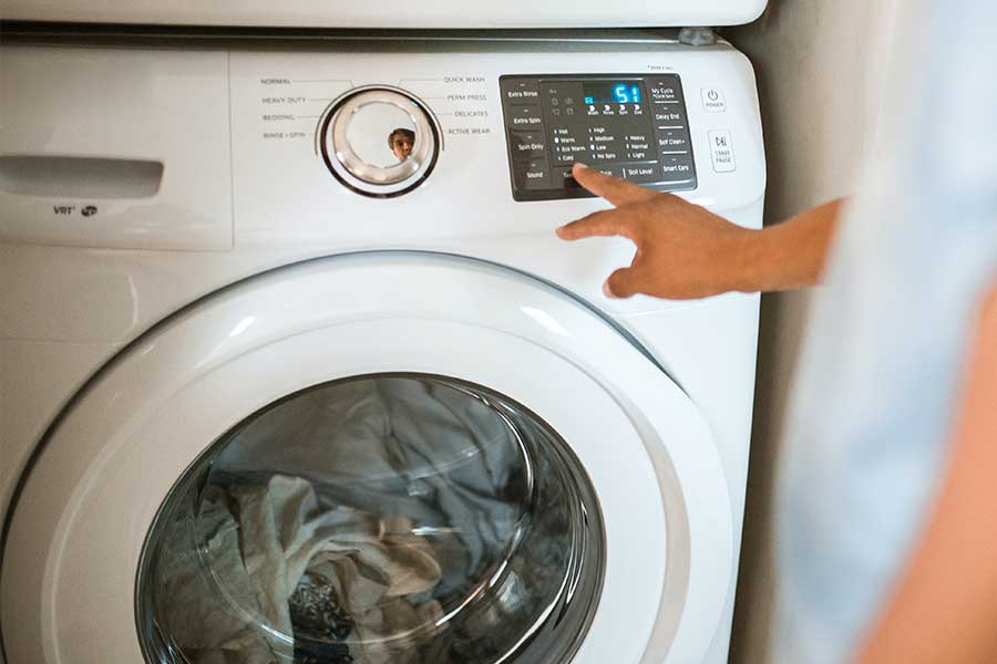 Person operating a washing machine